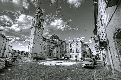 Main square with church and clock tower in Montaberner.