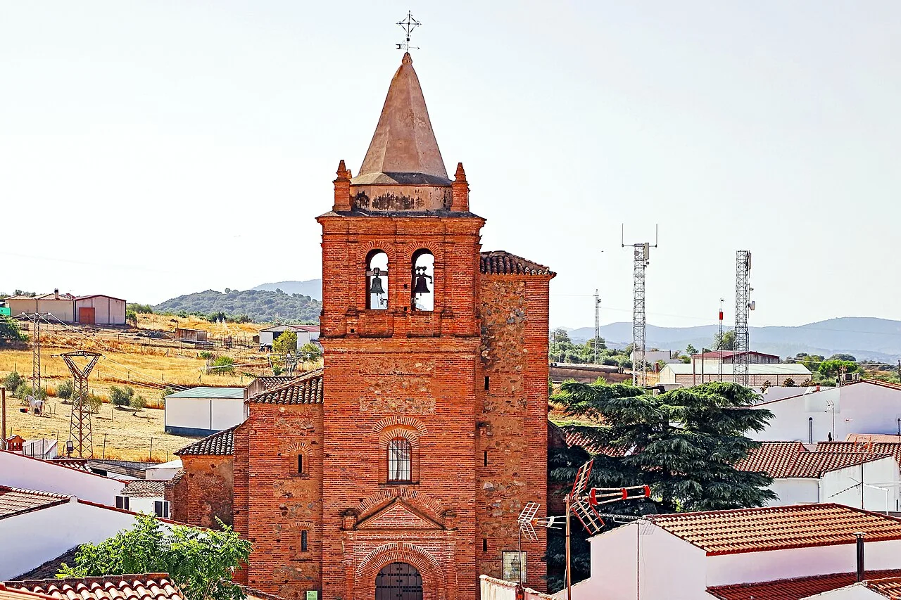 Brick tower and bell tower of the church in Trasierra.