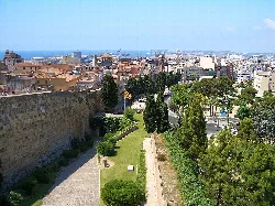 View of Tarragona with harbor and gardens.