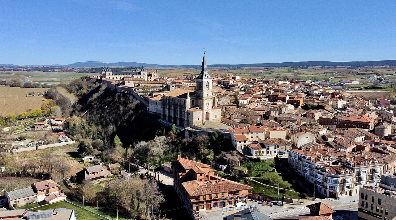 Aerial view of Lerma with church and houses in a rural setting.