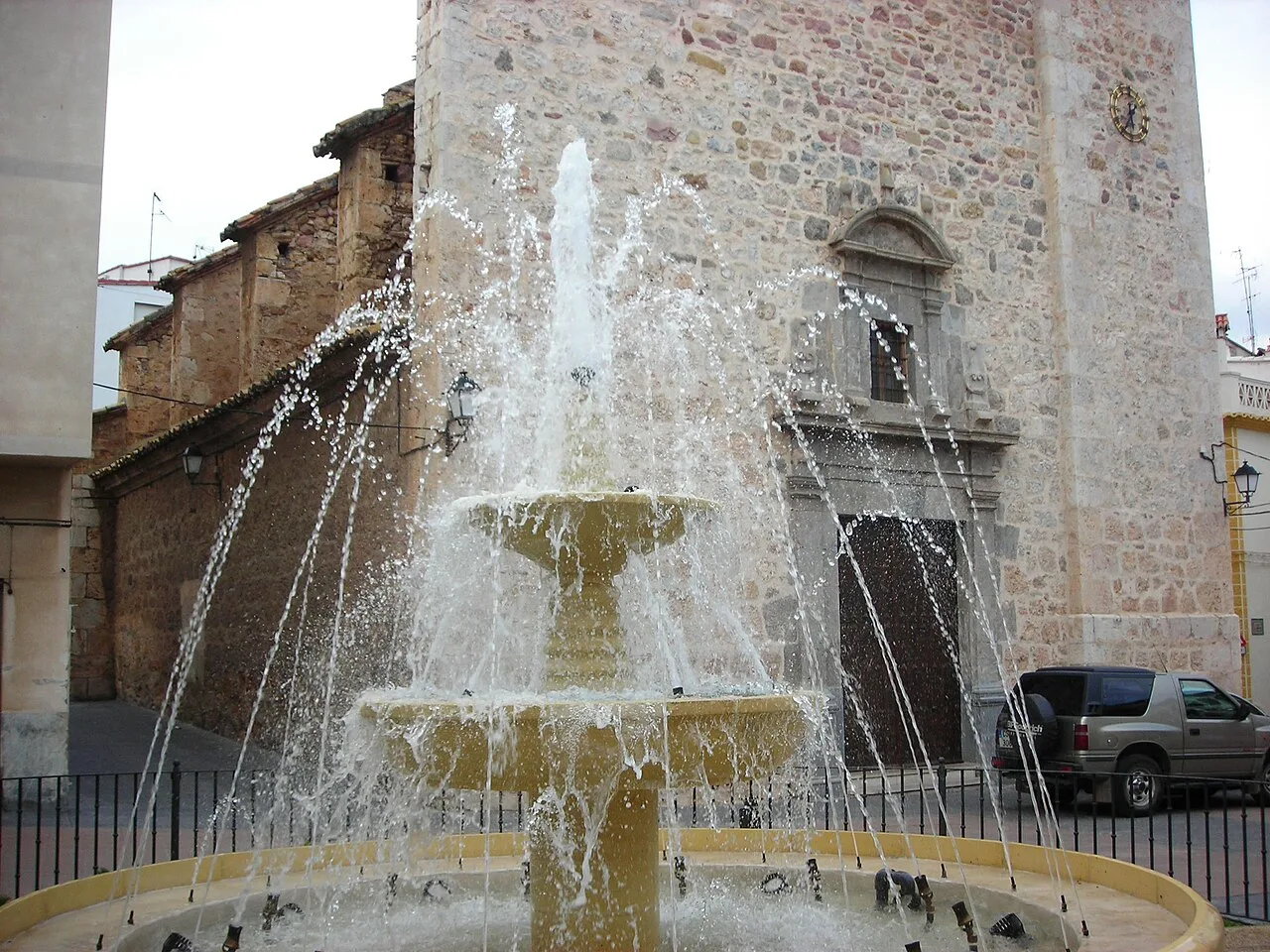Stone fountain with water in Geldo's main square.