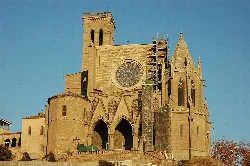 Gothic cathedral of Manresa with rose window and tall towers.