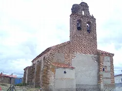 Church with brick bell tower in San Pascual, Ávila.