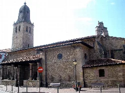 San Martin Church with stone tower and bell tower in Cabezón de la Sal.