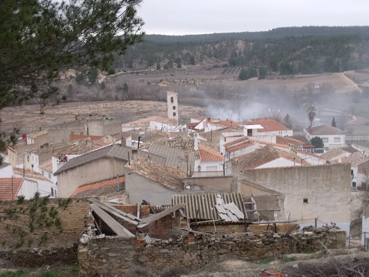 View of Villatoya with houses and hills in the background.