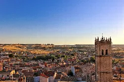 Panoramic view of Baltanás with church tower and rural landscape