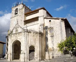 Stone church facade with tower and clock in Salvatierra-Agurain.