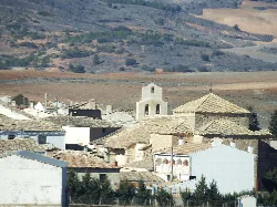 Houses and a church in Olmeda del Rey, Cuenca.
