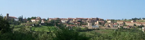 Panoramic view of Lumbreras de Cameros with houses on a hill.