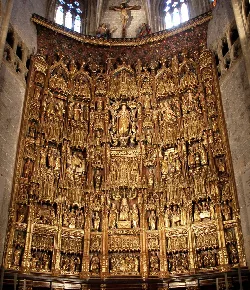 Golden main altarpiece with religious figures in Lequeitio Basilica.
