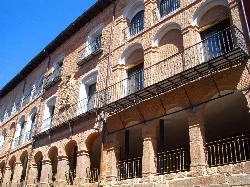 Building with arches and balconies on Calle Mayor Baja, Navarrete.