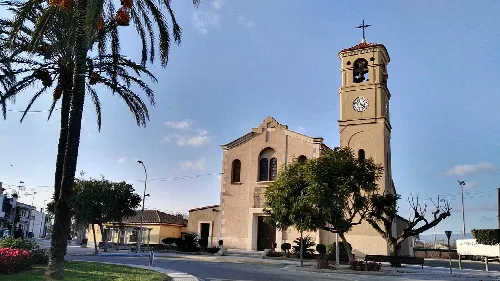 Church with tower and clock in Deltebre, Tarragona.