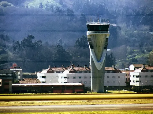 The following is the author's description of the photograph quoted directly from the photograph's Flickr page."Taken from the departures corridor, from the interior of the terminal. "