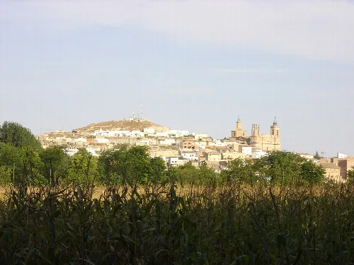 View of Épila with church and hill in Zaragoza.