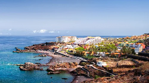 Panoramic view of Los Cancajos with beaches and colorful buildings.