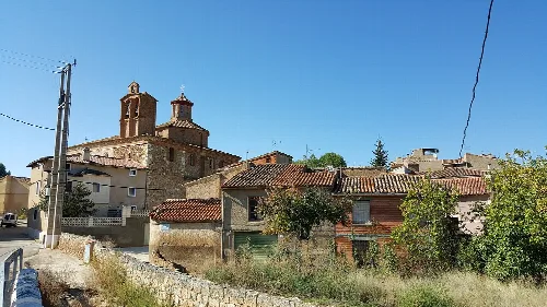 View of houses and a church in Villanueva de Jiloca, Zaragoza.