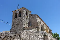 San Román Church with clock tower and bell tower in Cobos de Cerrato.