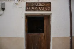 Wooden door with a wooden sign that says Ethnographic Museum.