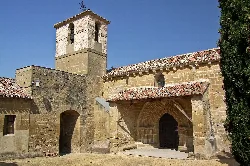 Church of San Román with tower and stone door in Villaseca.