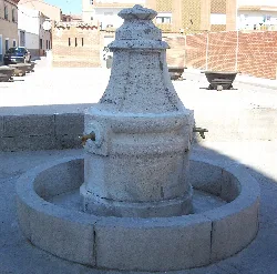 Stone fountain with inscription and two spouts in Cobeja.