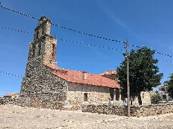 Santa Eufemia church in Pereruela, Zamora, with stone tower and red tiled roof.