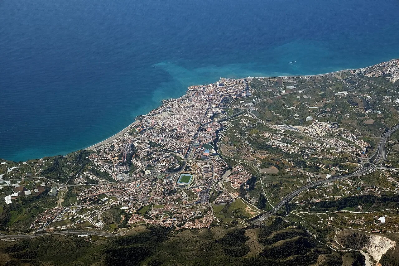 Aerial view of Nerja with beaches and housing along the coast.