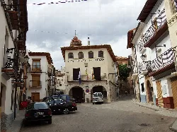 Building in San Agustín, Teruel, with the phrase "This land is Aragón" on the facade.
