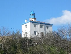 White lighthouse with blue dome in Zumaia, Guipúzcoa.