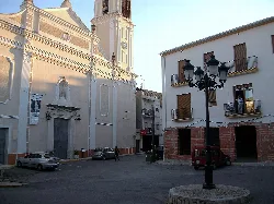 Square with church and street lamp in Llutxent, Valencia.