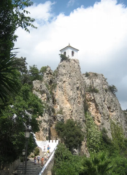 White church on top of a rocky cliff in Guadalest, Alicante.
