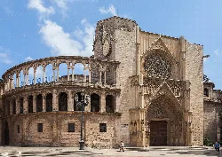 Facade of Valencia Cathedral with Gothic rose window and porch.