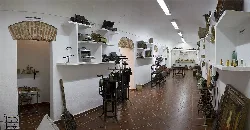 Interior of a room with shelves and objects in an ethnographic museum.