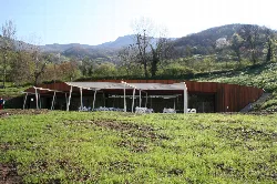 Reception building with metal and wood structure in Teverga, Asturias.