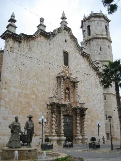 Facade of Sant Bartomeu church with tower and sculptures in Benicarló