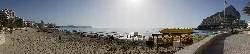 Panoramic of Levante beach in Calpe, with sand, sea, and mountains