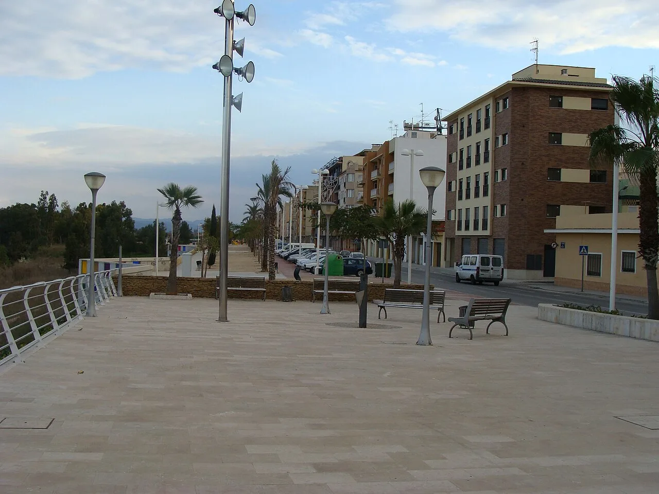 Avenue with benches and streetlights along the Magro river in Carlet.