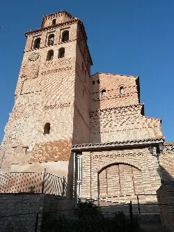 Brick tower with windows and Moorish details in Perdiguera.