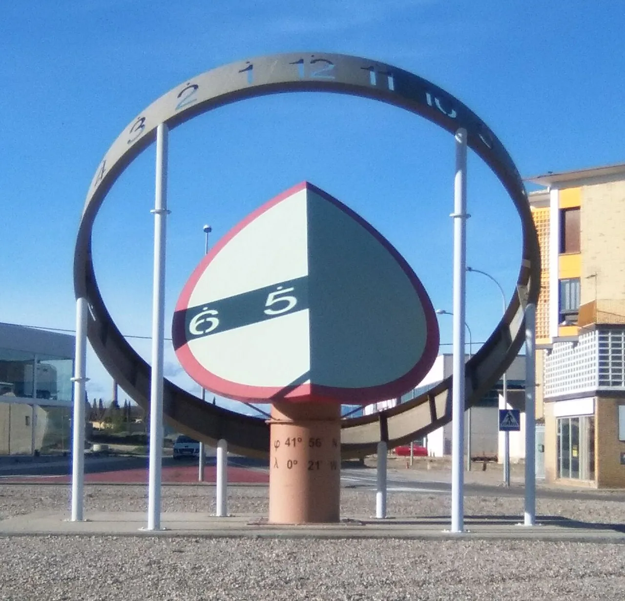 Modern sundial with metal structure and blue background in Grañén.
