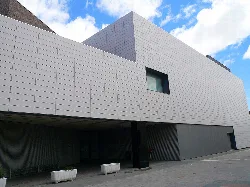 Building with modern design, gray walls, and small windows in Navarra.