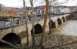 Stone bridge with arches over the Pisuerga river in Alar del Rey.
