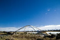 Nelson Mandela Bridge in El Prat de Llobregat under blue sky.
