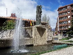 Miner sculpture on a monument with fountain in Guardo.