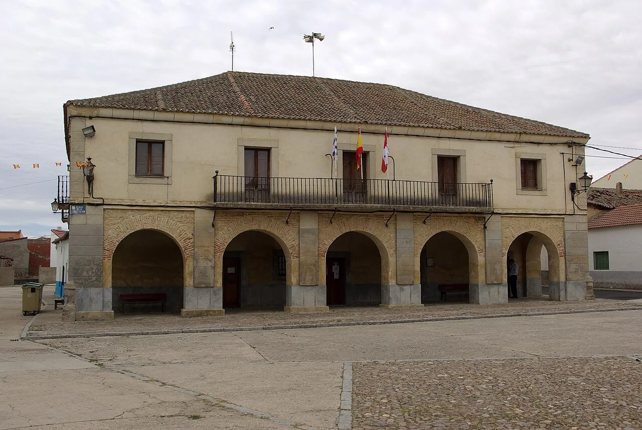 Town hall building with arches and balcony in Labajos.