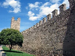 Stone wall with tower and battlements in Montblanc, Tarragona.