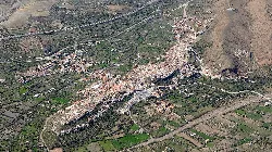 Aerial view of Fiñana with houses, streets, and agricultural fields.