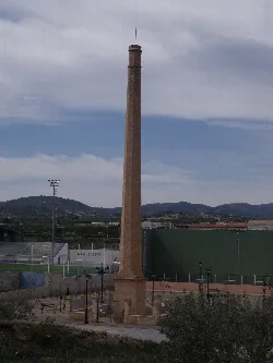 Brick chimney protected at a sports field in Casinos.