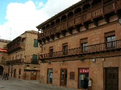 Stone building with wooden balconies in Villanueva de los Infantes.