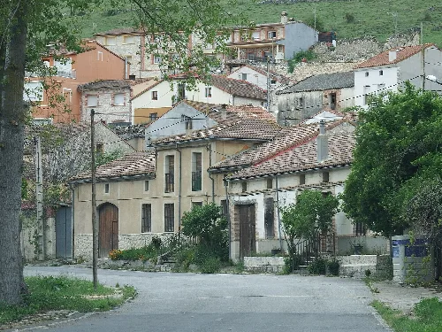Traditional houses on a street in Aldeasoña, Segovia.
