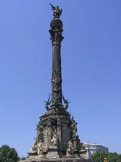 Tall column with statues at the base and a figure at the top.