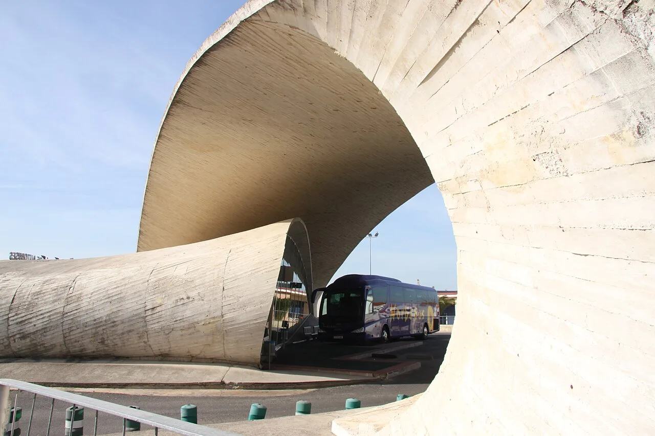 Modern curved concrete structure at Casar de Cáceres bus station.